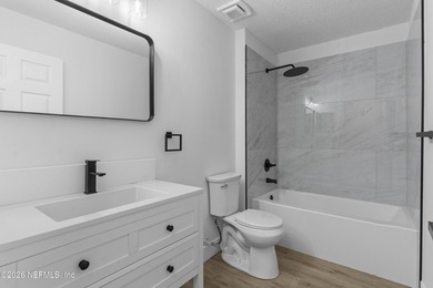 Welcome home to this beautifully renovated 4-bedroom, 2-bath - photo 32