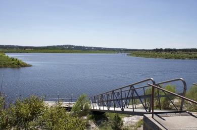 Scenic lot featuring mature oak trees, ideally located just - photo 7