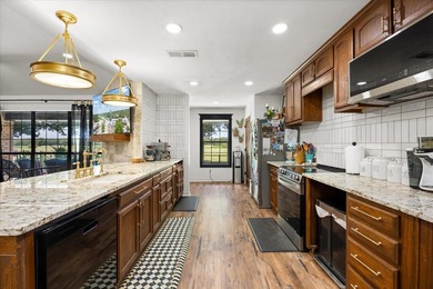 Completely remodeled and beautifully updated, this exceptional - photo 8