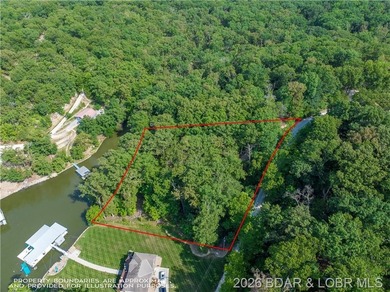 !.6 acres on beautiful Lake of the Ozarks. Gentle sloping lot - photo 37