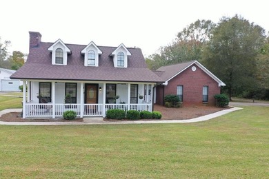 Tucked away in a quiet, private setting, this move-in-ready home - photo 1