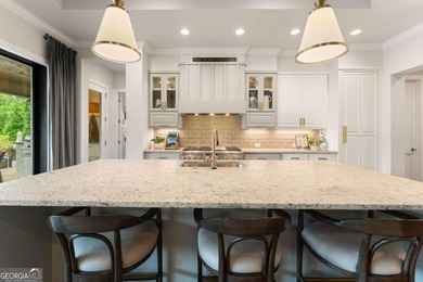 AR Homes built this custom residence around one of Chattahoochee - photo 22