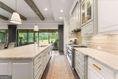 AR Homes built this custom residence around one of Chattahoochee - photo 23
