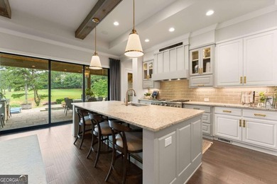 AR Homes built this custom residence around one of Chattahoochee - photo 26