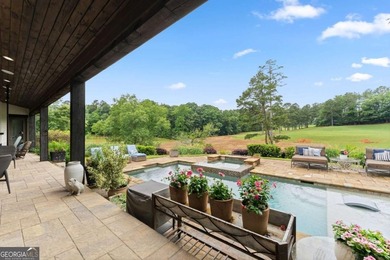 AR Homes built this custom residence around one of Chattahoochee - photo 30