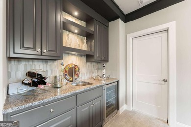 AR Homes built this custom residence around one of Chattahoochee - photo 39