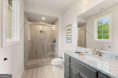 AR Homes built this custom residence around one of Chattahoochee - photo 46