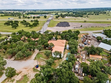 Located just outside city limits with no city zoning, this 5+