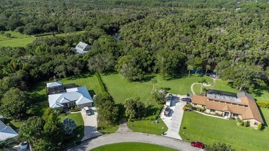 BEAUTIFUL > 1 ACRE WATERFRONT PROPERTY IN QUIET NEIGHBORHOOD - photo 3