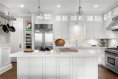 Sophisticated Penthouse unit with soaring ceilings, oversized