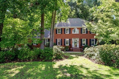 Tucked beneath a canopy of mature hardwoods on a quiet - photo 2