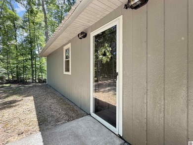 SECLUDED! Tucked away on 1.75 wooded acres, this cute 3-bedroom - photo 2