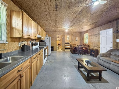 SECLUDED! Tucked away on 1.75 wooded acres, this cute 3-bedroom - photo 4