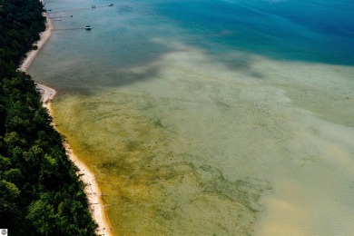 Experience the perfect balance of green fairways and blue water