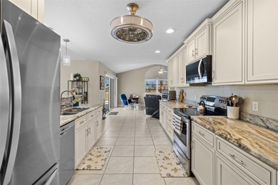 This beautifully updated 3-bedroom, 2.5 bathroom pool home is - photo 12