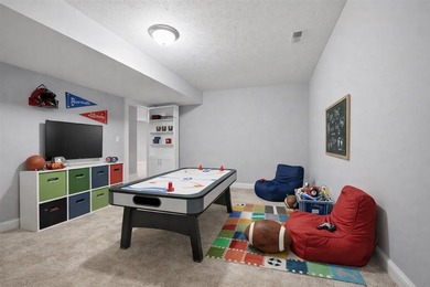 Gorgeous zero-lot home with wood flooring throughout main level