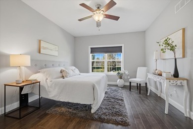 Gorgeous zero-lot home with wood flooring throughout main level