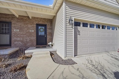 Gorgeous zero-lot home with wood flooring throughout main level