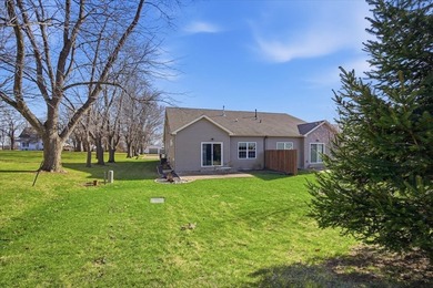 Gorgeous zero-lot home with wood flooring throughout main level