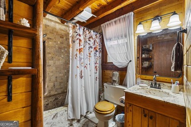 Rustic charm meets modern comfort in this beautiful log home - photo 16