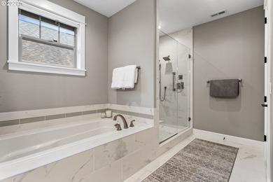 Modern, highly upgraded open-concept golf course condo with