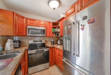 This 3-bedroom, 2-bathroom single-family home at 15216 SW 112th - photo 9