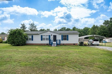 This 3 bedroom, 2 bath manufactured home is on a level .60 acre - photo 1