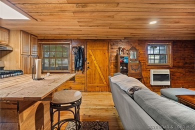 Escape to this adorable 2-bed, 2-bath rustic log cabin tucked - photo 11
