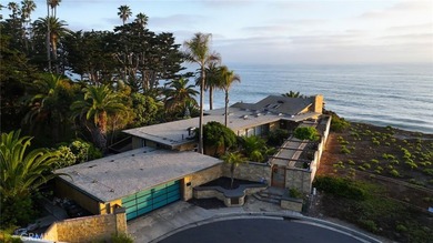 Poised at the end of a private, ocean front cul de sac in the - photo 1
