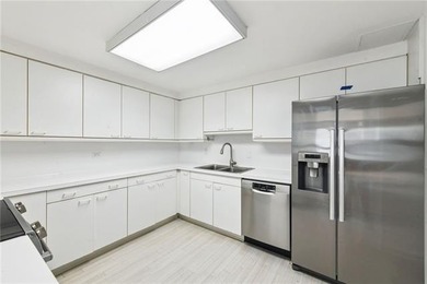 Stunning corner residence with expansive windows, wall to wall