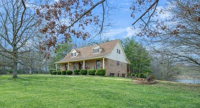 Situated on 4.06 acres in Bryant, Alabama, this Cape Cod-style - photo 3