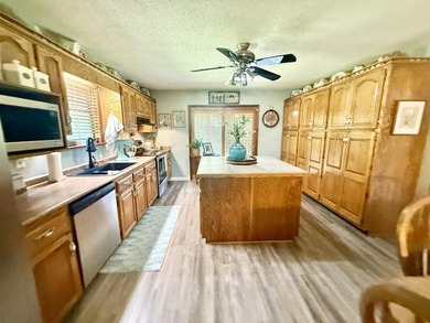 Situated on 4.06 acres in Bryant, Alabama, this Cape Cod-style - photo 8