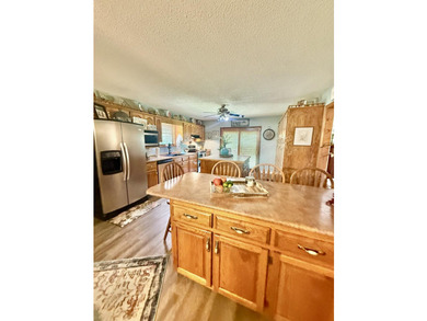 Situated on 4.06 acres in Bryant, Alabama, this Cape Cod-style - photo 9