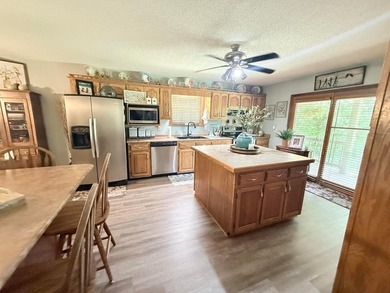 Situated on 4.06 acres in Bryant, Alabama, this Cape Cod-style - photo 10