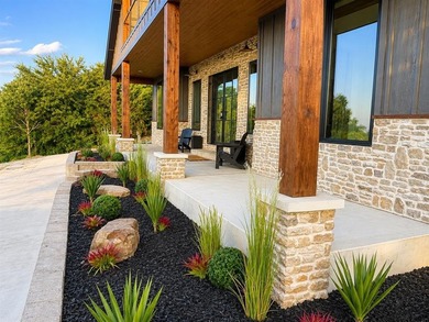 Completed in 2025, this exceptional custom lake home in the - photo 2