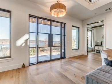Completed in 2025, this exceptional custom lake home in the - photo 3