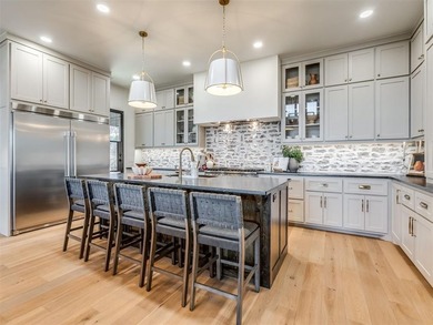 Completed in 2025, this exceptional custom lake home in the - photo 9