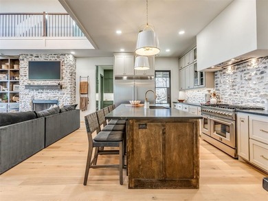 Completed in 2025, this exceptional custom lake home in the - photo 10
