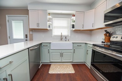 MOTIVATED SELLERS! Welcome to lakefront living at its finest on - photo 4