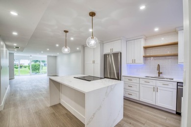 Experience curated luxury living in this sun-filled, completely - photo 3