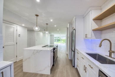Experience curated luxury living in this sun-filled, completely - photo 8