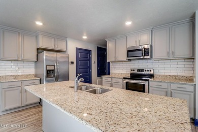Welcome to this well-maintained four-bedroom home, centrally - photo 5