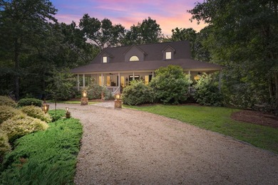 Hidden among the privacy of lush hardwoods in coveted Lake Adger - photo 1