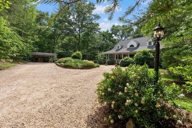 Hidden among the privacy of lush hardwoods in coveted Lake Adger - photo 3