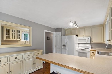 Discover the potential of this raised ranch located in the - photo 11