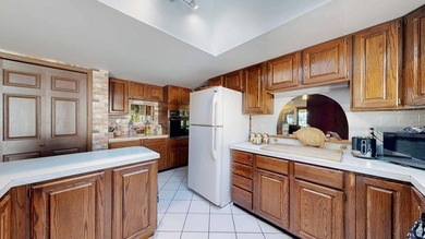 This charming home offers nearly 2,100 finished sq ft with two