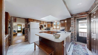 This charming home offers nearly 2,100 finished sq ft with two