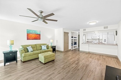 Charming condo featuring fabulous water views on one side and a