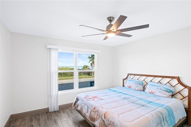 Charming condo featuring fabulous water views on one side and a