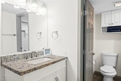 Charming condo featuring fabulous water views on one side and a